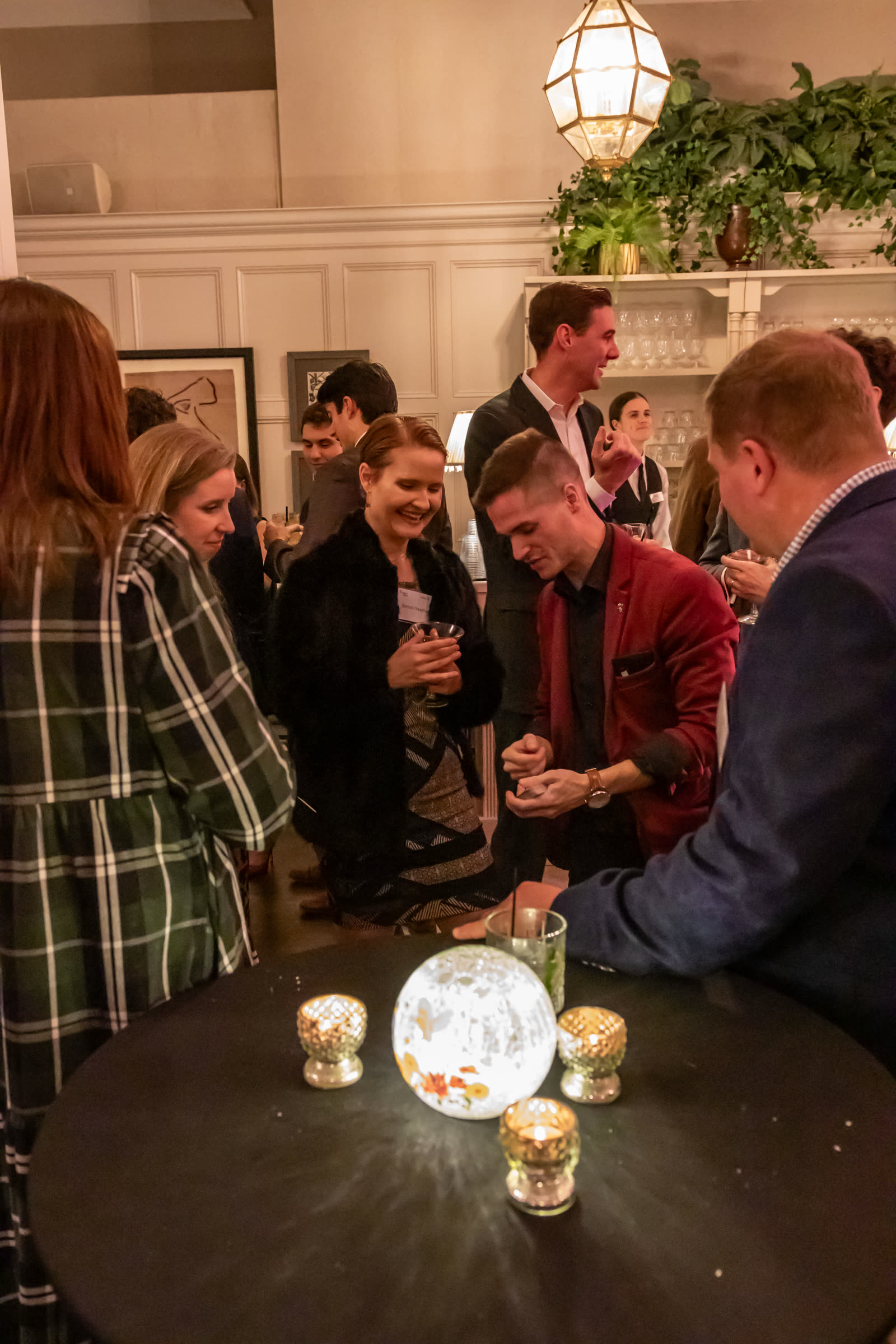 Caleb Hyatt entertaining guests at an upscale corporate reception